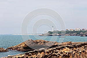 Unique in their color, texture and shape, Rocher de la Vierge rocks protruding from sea.Â Biarritz, French Basque Country